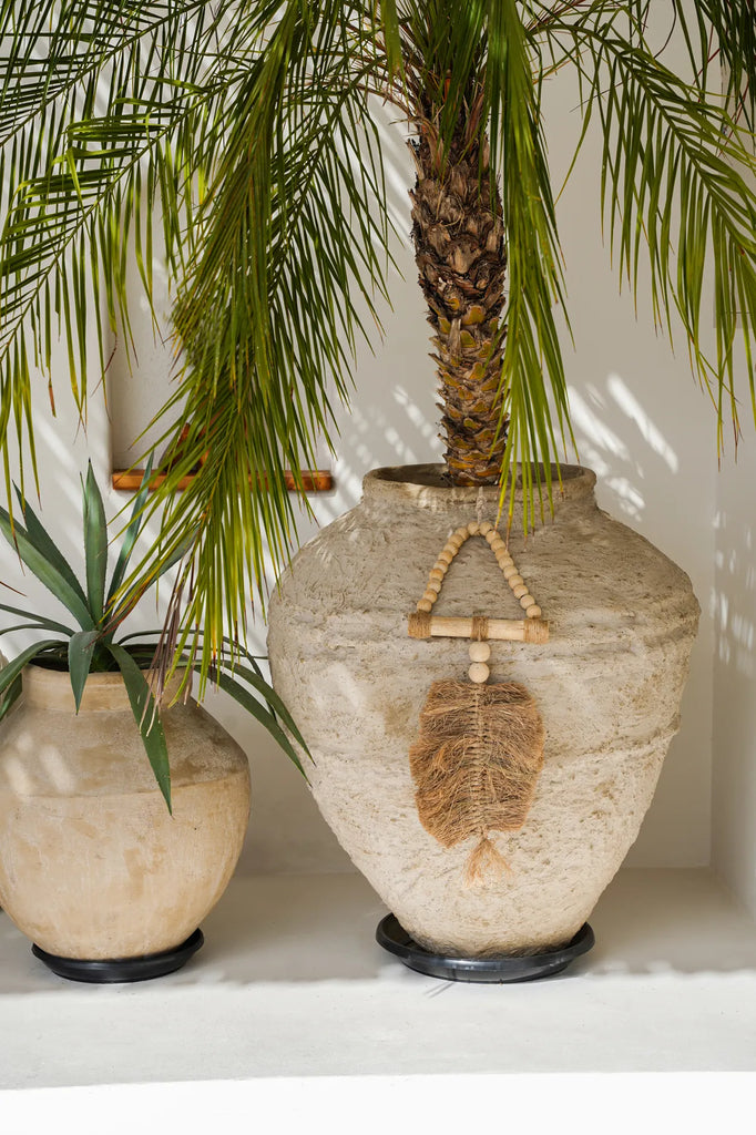 La décoration suspendue triangle en raphia
