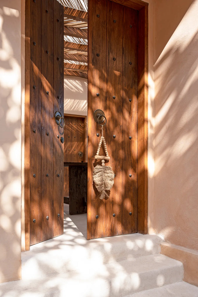 La décoration suspendue triangle en raphia